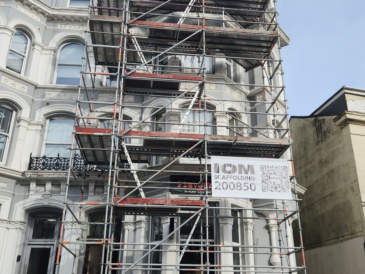 Window & flat roof repairs scaffold in Douglas