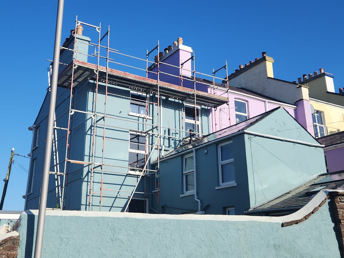 Roof repairs, end-terrace house scaffold in Peel